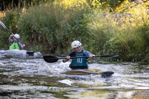 Asher enjoys rowing in the canoe.