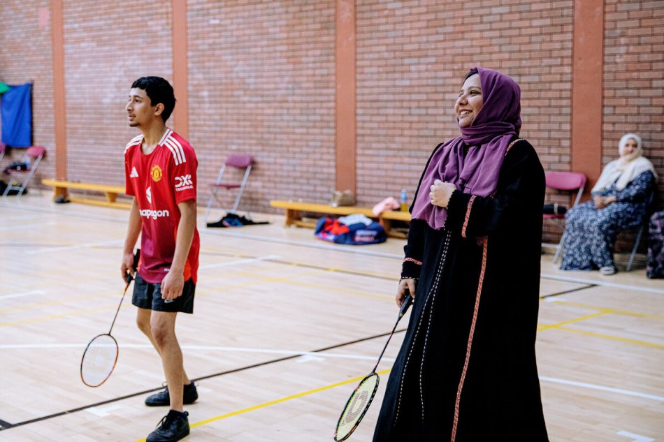 A woman playing badminton