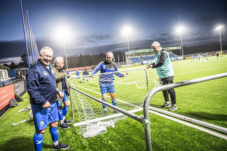 Players assemble a portable goal.
